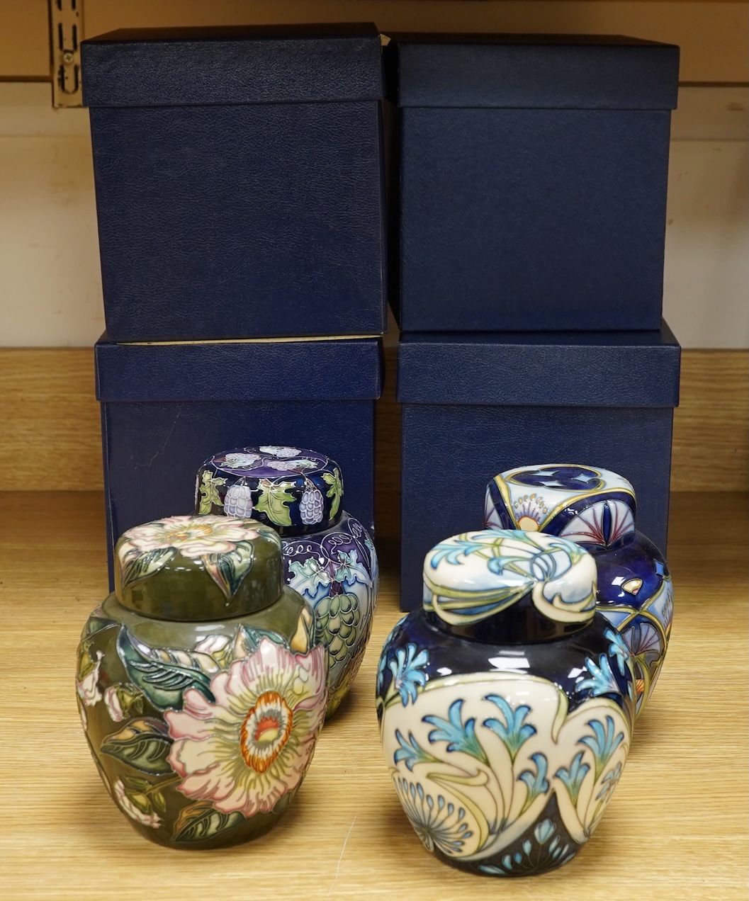 Four Moorcroft ginger jars and covers - ‘Midnight Blue’, ‘Inula’, ‘Sonans’ and ‘Gustav Augusta’ (4) 17cm high